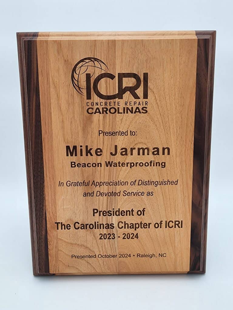 A wooden recognition plaque awarded by ICRI Concrete Repair Carolinas to Mike Jarman of Beacon Waterproofing for service as President of The Carolinas Chapter of ICRI for 2023-2024, presented in October 2024 in Raleigh, NC.