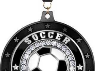 A soccer-themed medal featuring a black and white soccer ball in the center, surrounded by a ring of decorative stones and the word 'SOCCER' repeated twice, with a black ribbon attached.