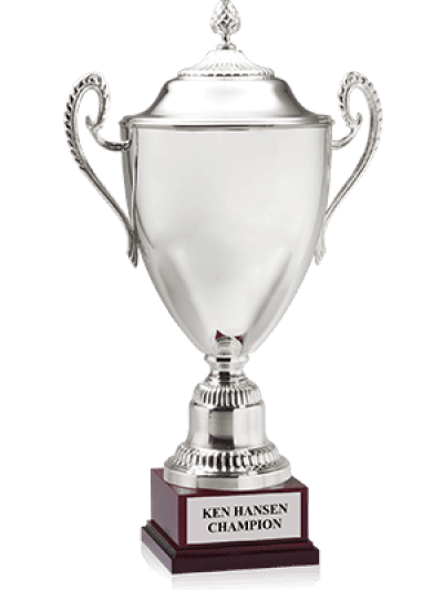 A silver sports trophy cup with ornate handles and a wooden base displaying the engraving "Ken Hansen Champion."