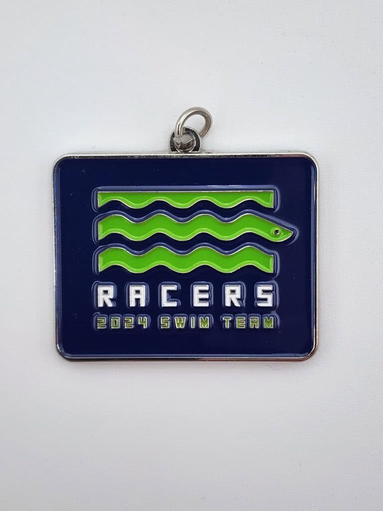 A rectangular custom medal with a navy blue background and wavy green lines, featuring the text 'RACERS 2024 SWIM TEAM' in white and green lettering.